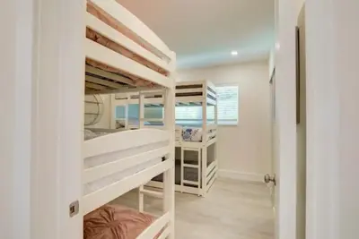a room with four bunk beds in it at Flamingo House with Cinema, Pool & Chill Area in Miami