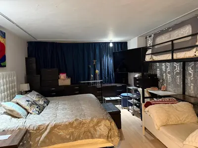 a bedroom with a bed and a desk and a bunk bed at Penthouse 2 stroy 2 bedroom water views to share in Miami