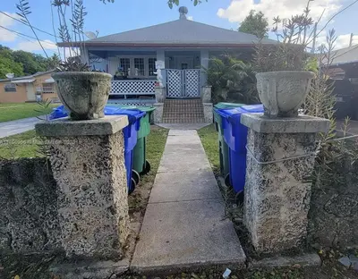 two concrete pillars in front of a house at Azucar Miami in Miami