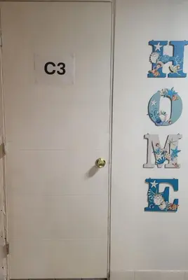 a white door with a sign on it at Azucar Miami in Miami