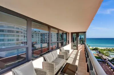 a balcony with chairs and a view of the ocean at Luxury Ocean View Condo with Beach Service 1521 in Miami Beach