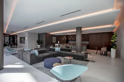 a living room with a couch and a table at Luxury & Modern Condo in Design District with Pool in Miami