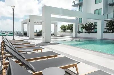 a swimming pool on the roof of a building at Luxury & Modern Condo in Design District with Pool in Miami