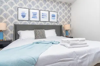 a bedroom with a bed with towels on it at Cozy and Comfortable 1BR Near Calle Ocho and Brickell in Miami