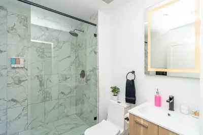 a bathroom with a shower with a toilet and a sink at Cozy and Comfortable 1BR Near Calle Ocho and Brickell in Miami