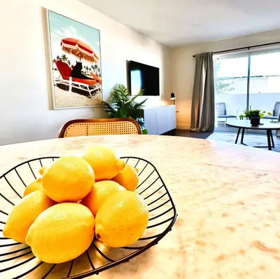 a pile of lemons on a plate on a table at Homey Haven in Vibrant South Beach in Miami Beach