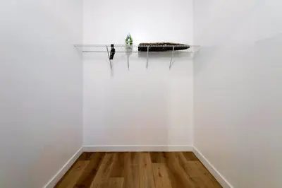a room with white walls and a shelf with a cat on it at Spacious 3BR Townhouse with Free Parking Included! in Miami