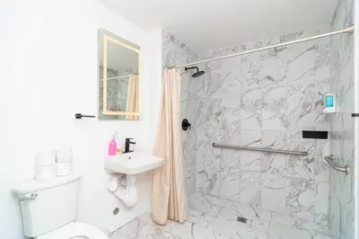 a bathroom with a shower and a toilet and a sink at Relaxing 1BR in Miami Close to Brickell and South Beach in Miami