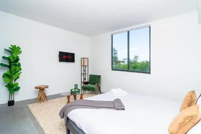 a white bedroom with a bed and a window at Miami 1BR New Oasis with King Bed Near Brickell & Marlins Park in Miami
