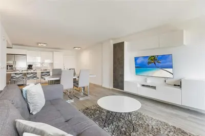 a living room with a couch and a table at Skyline Paradise in Sunny Isles Beach in Sunny Isles Beach