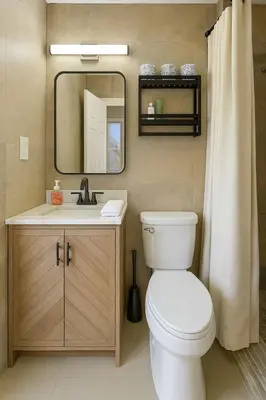 a bathroom with a toilet and a sink and a mirror at Quiet Shenandoah Retreat, Central Miami in Miami
