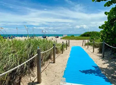 a blue pathway to the beach at Ocean Drive Suite in South Beach Family & Pet Friendly in Miami Beach