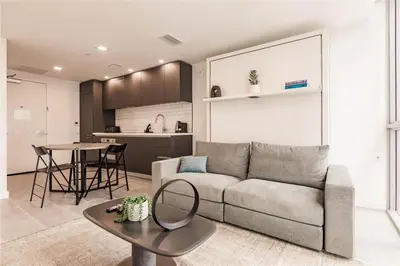 a living room with a couch and a table at Exclusive Condo w Beautiful City Views and Full Amenities! in Miami