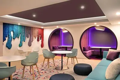 a room with two circular mirrors and tables and chairs at Exclusive Condo w Beautiful City Views and Full Amenities! in Miami
