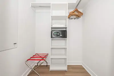 a white shelf in a room with a microwave at Modern Resort with Amazing Pool in Hallandale Beach