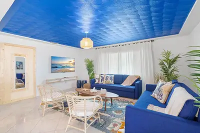 a living room with a blue ceiling at Casa Santorini - Big Pool - Barbacoa - Fun and Relax in Miami