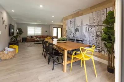 a dining room with a wooden table and chairs at Heated pool - 5min Coral Gables - Family Vacation in Miami