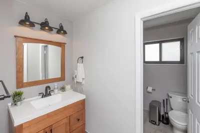a bathroom with a sink and a mirror at Heated pool - 5min Coral Gables - Family Vacation in Miami