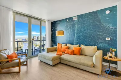 a living room with a couch and a wall with a map at Spectacular Apartment with Amazing Pool in Hallandale Beach