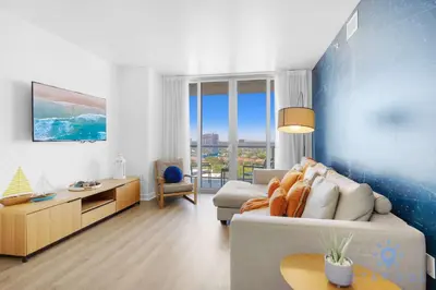 a living room with a couch and a table at Urban Apartment Balcony & Pool in Hallandale Beach