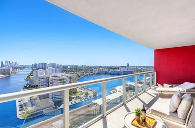 an apartment balcony with a view of the water at Stylish Apartment 2BD 2BTH in Hallandale Beach