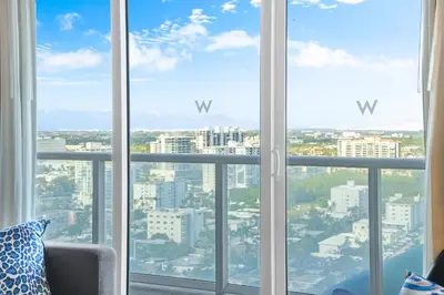 a view of a city from a room with windows at 2BR W Resort, Birds eye view of it all, Professionally Designed in Fort Lauderdale