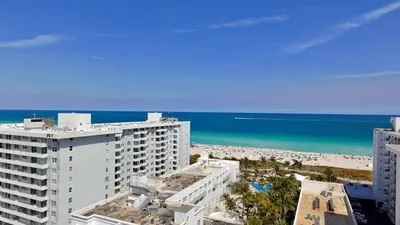 a view of the beach from a building at Art Deco Suite Steps from Beach in South of Fifth in Miami Beach