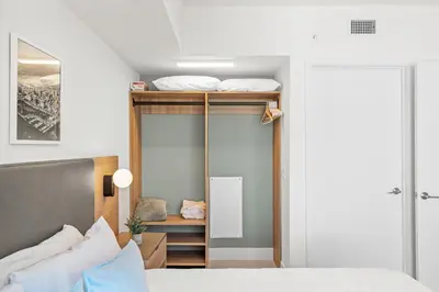 a bedroom with a bunk bed with a closet at NEW 28th Floor unit - Breathtaking Bay and Downtown Views in Miami