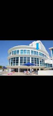 a large building with cars parked in front of it at Luxury - Ocean front - Free Parking - 3 Bed 2 Bath in Miami Beach
