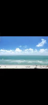 a view of a beach with the ocean in the background at Luxury - Ocean front - Free Parking - 3 Bed 2 Bath in Miami Beach