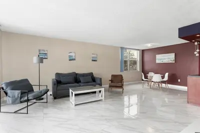 a living room with a couch and a table at Bay Harbor Sunset Apt 2A in Miami Beach