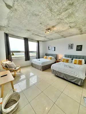 a bedroom with two beds and a large window at Stylish and Spacious Condo Prefect to Enjoy Miami! in Miami