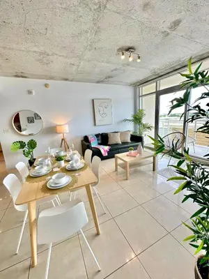 a living room with a table and chairs at Stylish and Spacious Condo Prefect to Enjoy Miami! in Miami
