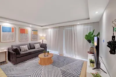 a living room with a couch and a table at Modern 2Bedroom in South Beach - Steps away from Lincoln Rd in Miami Beach