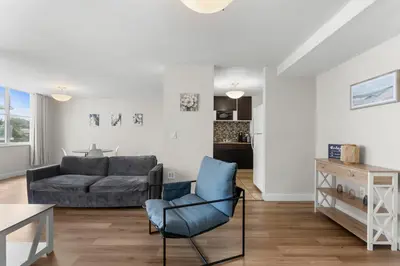 a living room with a couch and a chair at Bay Harbor Sunset Apt 3B in Miami Beach