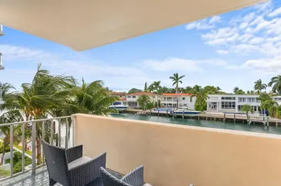 a view of the water from the balcony of a resort at Bay Harbor Sunset Apt 3C in Miami Beach