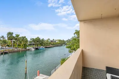a view of a river from a building at Bay Harbor Sunset Apt 3C in Miami Beach