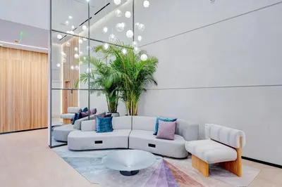 a living room with a couch and a plant at 227-2212AM DOWNTOWN MIAMI STUDIO in Miami