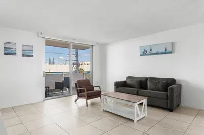 a living room with a couch and a coffee table at Bay Harbor Sunset Apt 4A in Miami Beach