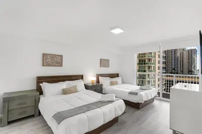 a bedroom with two beds and a balcony at Stylish Brickell Condo with Stunning Views & Premier Amenities in Miami