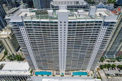 an aerial view of a large building in a city at Waterfront and City Lights 1-BR With Free Parking in Miami