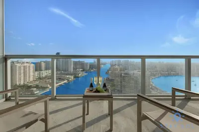 a balcony with a view of a river at Stylish Beach Apartment with Pool in Hallandale Beach