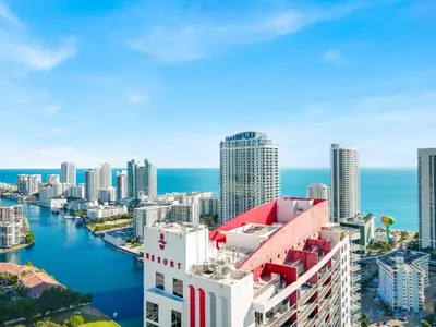 an aerial view of a city with the ocean at Stylish Beach Apartment with Pool in Hallandale Beach