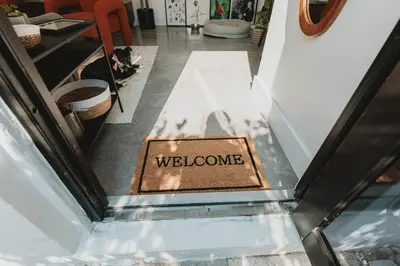 a welcome sign on the floor of a store at Miami Oasis - Unit A in Miami