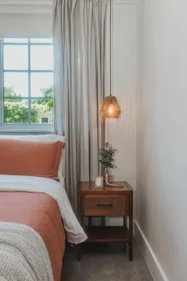 a bedroom with a bed and a table with a lamp at Miami Oasis - Unit A in Miami