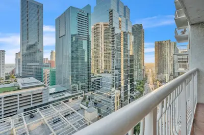 a balcony with a view of a city skyline at Cozy 1 Bedroom Apt in The Heart of Brickell in Miami