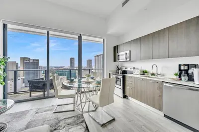 a kitchen and dining room with a view of a city at City Views Studio Downtown Miami in Miami