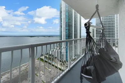 a balcony with a view of the ocean and a building at Oceanview Haven Spacious Inviting for 8 Guests in Miami