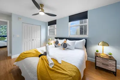 a bedroom with a bed and a ceiling fan at Oceanview Haven Spacious Inviting for 8 Guests in Miami