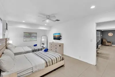 a bedroom with two beds and a ceiling fan at Luxury Heated Pool Villa Hollywood Beach & Casino in Hollywood